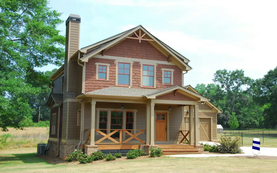 newer home with chimney in country setting