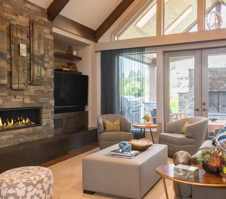 Fireplace burning in large living room