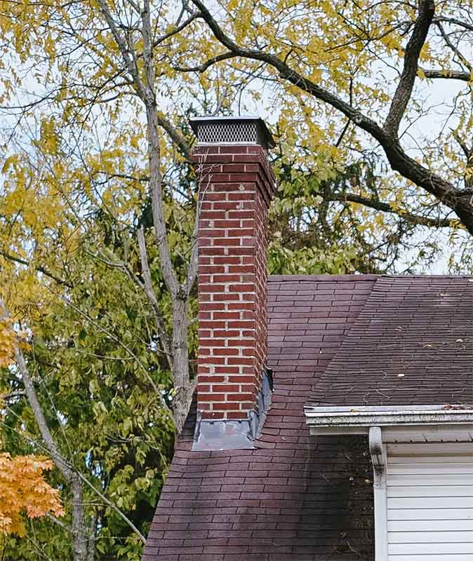 Hansen And Sons-Stock photo of chimney cap Chimney with silver cap