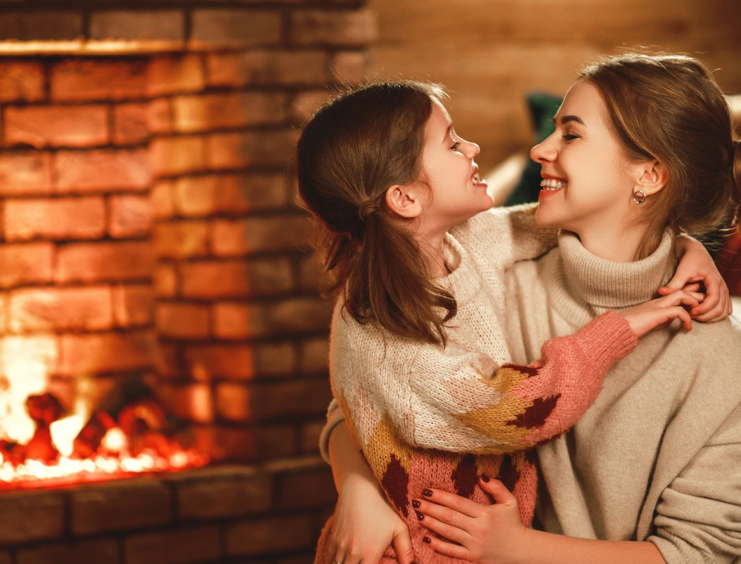 family by the fireplace img Fireplace burning under flat screen tv