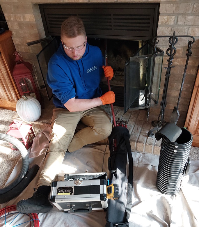 brick chimney on roof at sunrise