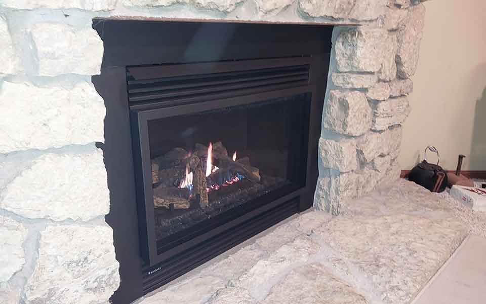 chimney tech working on fireplace