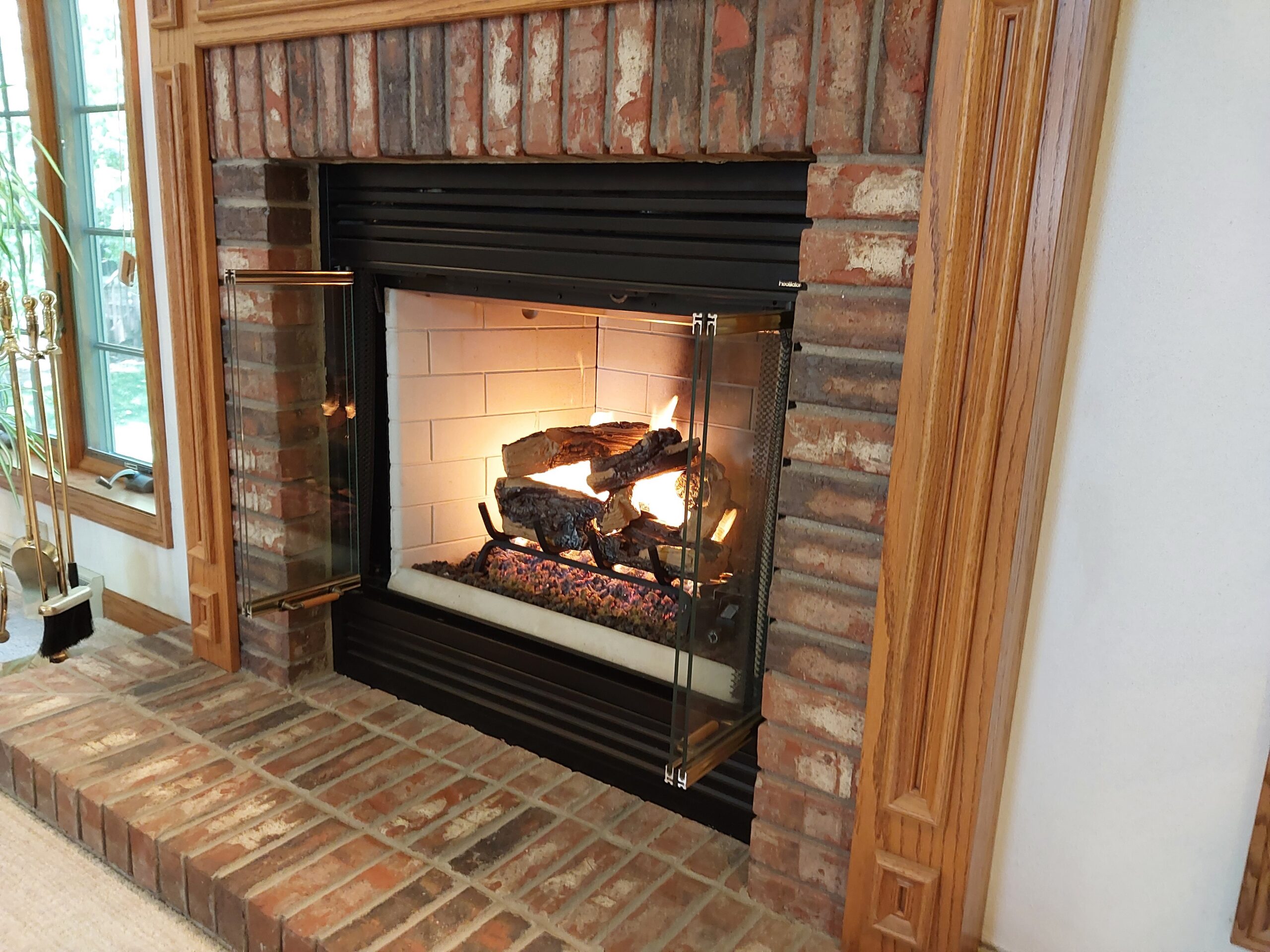 A masonry fireplace that's been renovated.